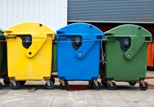 Construction workers clearing waste at a Hammersmith site